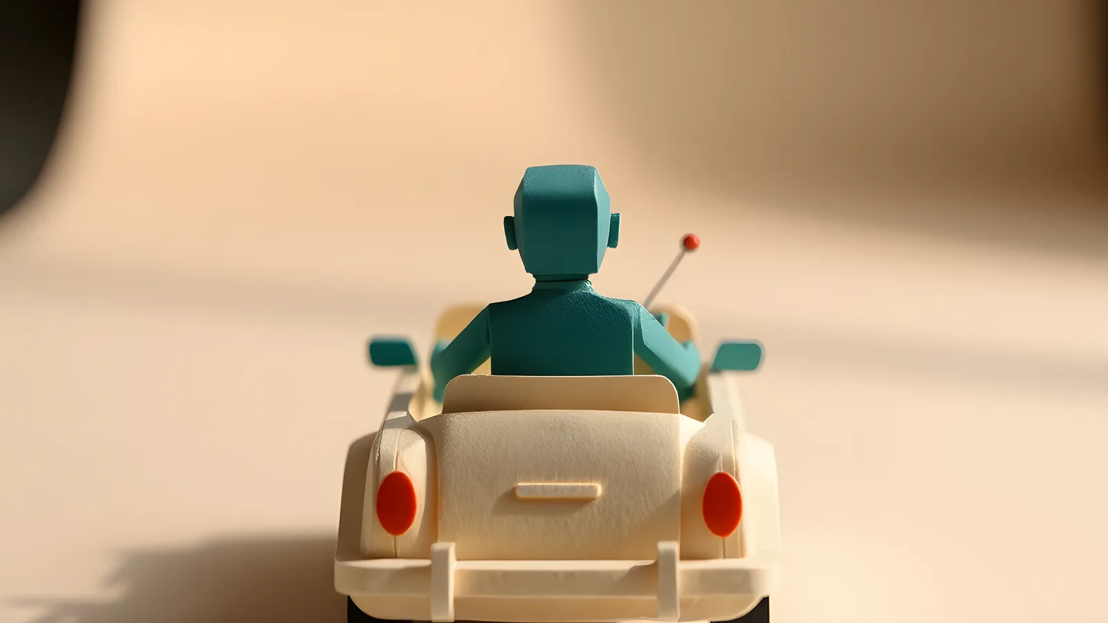 Paper-craft scene: a teal paper figure sits in a small cream paper convertible on an open, clear road.