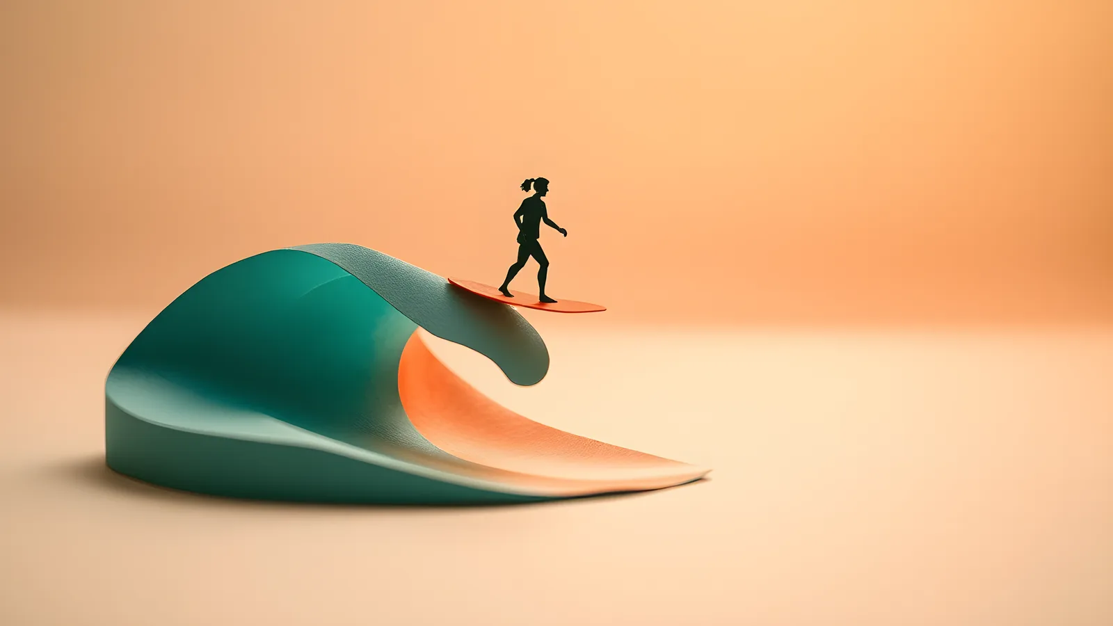 A tiny silhouette surfer balanced on a small coral surfboard atop a curling teal paper wave with a coral crest, against a peach paper sky